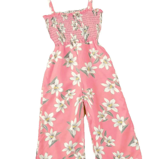 A pink wide-leg jumpsuit with a white and green floral print, featuring a smocked bodice and thin shoulder straps, shown against a plain white background.