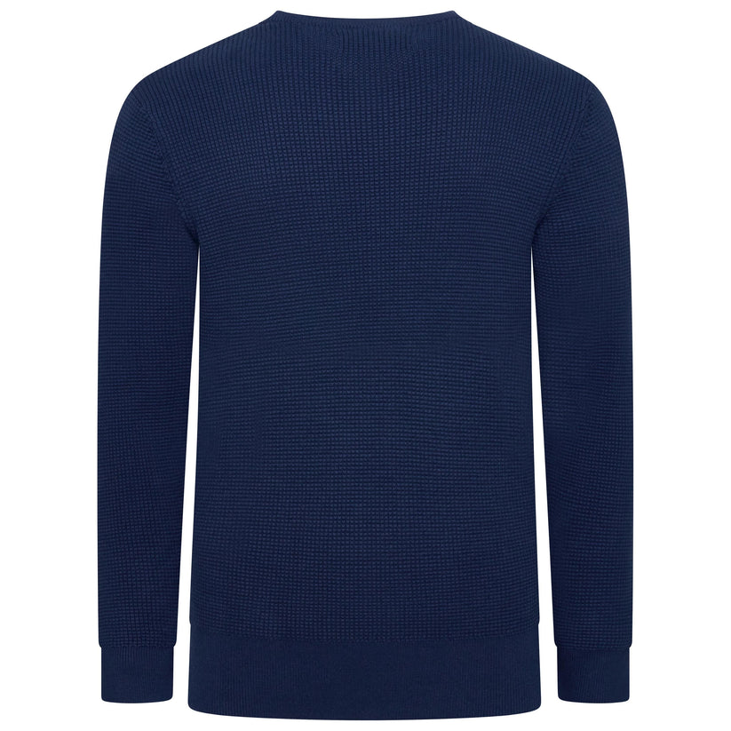 A navy blue long-sleeve crewneck sweater with a textured waffle knit pattern, shown from the back on a plain white background.