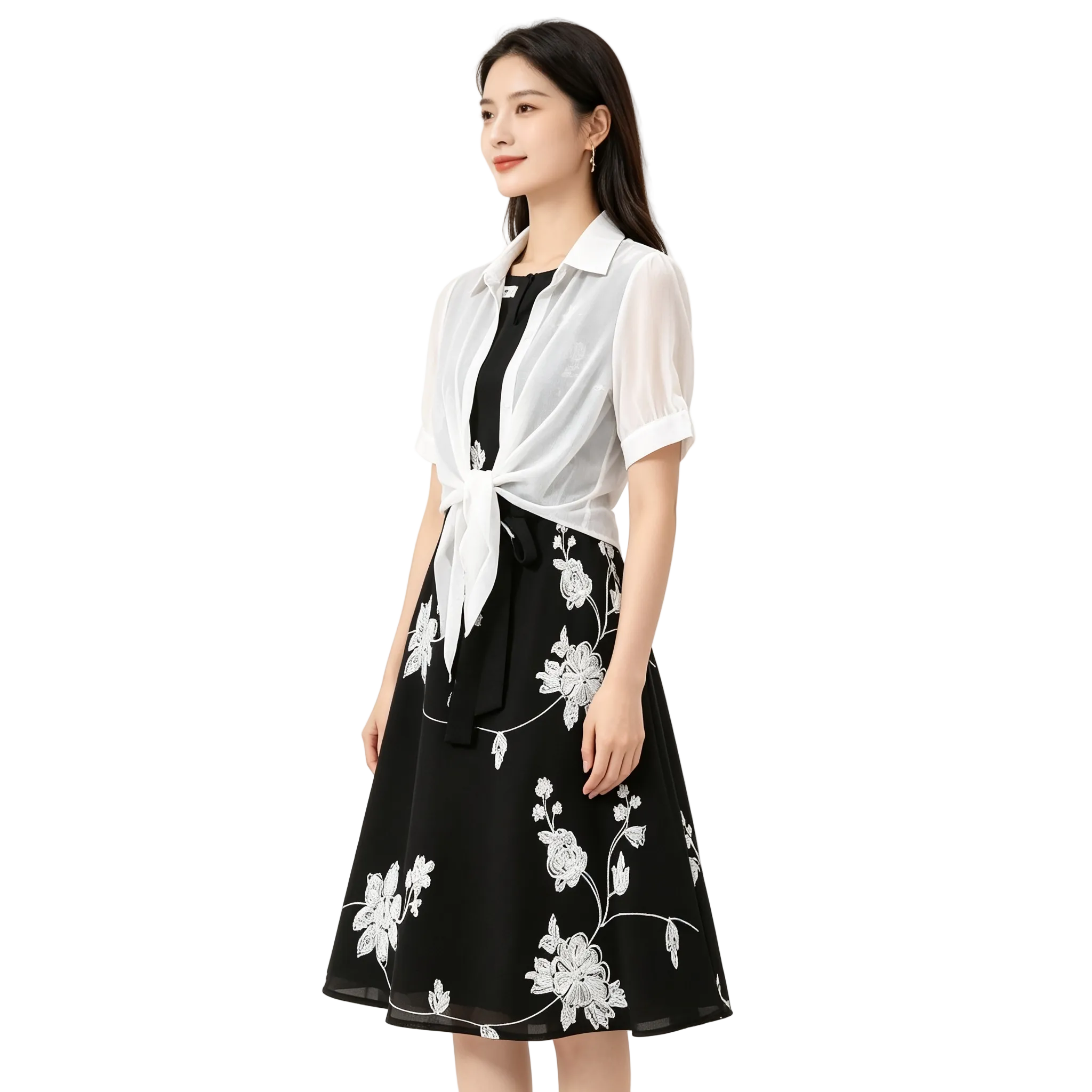 Woman wearing a black floral dress with a white blouse on a white background