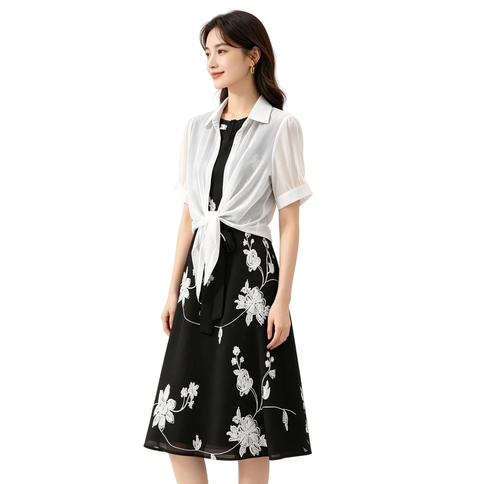 Woman wearing a black floral dress with a white blouse on a white background