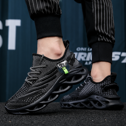 Black athletic shoes with a green accent on a dark background