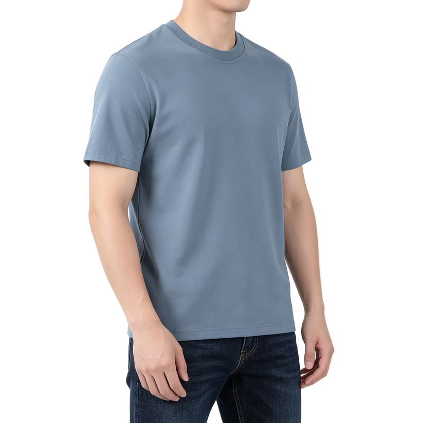 Person wearing a plain blue t-shirt on a white background