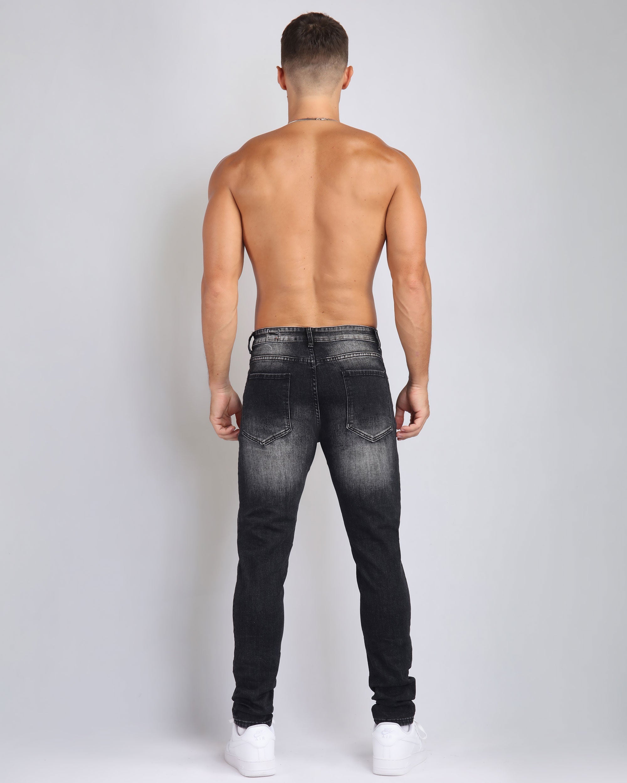 Street Art Chic Ripped Black Jeans with Graffiti Paint Drawing