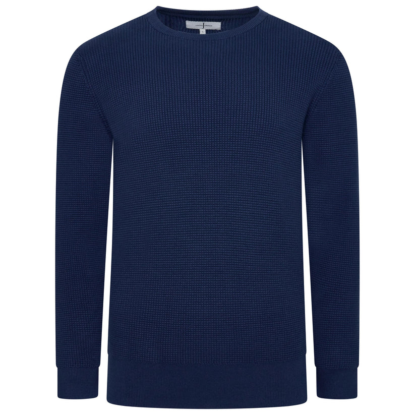 A navy blue long-sleeve crewneck sweater with a textured waffle knit pattern, shown on a plain white background.