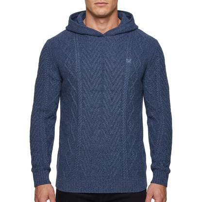 A man wearing a textured navy blue knit pullover hoodie with a small embroidered logo on the left chest, shown against a plain white background.