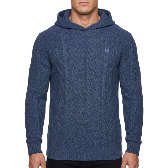 A man wearing a textured navy blue knit pullover hoodie with a small embroidered logo on the left chest, shown against a plain white background.