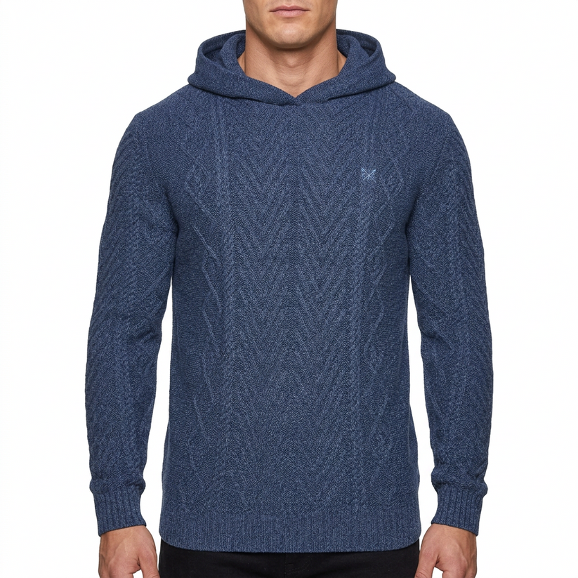 A man wearing a textured navy blue knit pullover hoodie with a small embroidered logo on the left chest, shown against a plain white background.