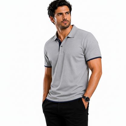 Man wearing a gray polo shirt with product features highlighted on a white background