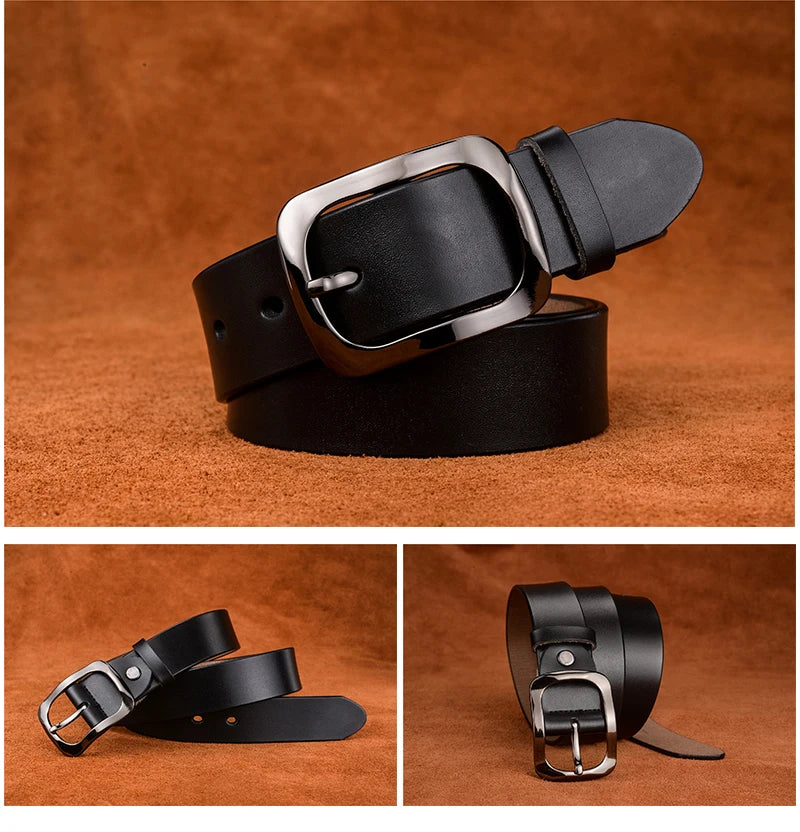 Black leather belt with silver buckle on a brown background