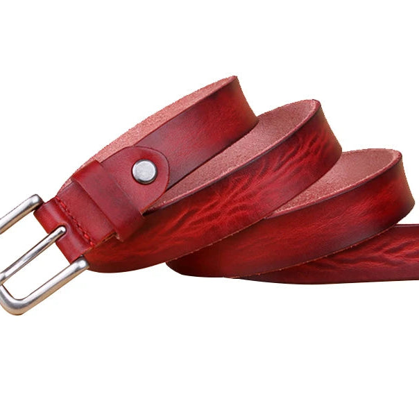 Red leather belt with silver buckle on a white background