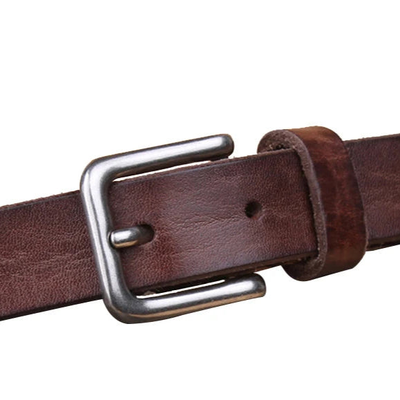 Brown leather belt with a silver buckle on a white background