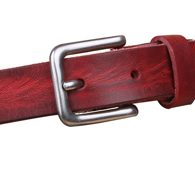 Red leather belt with a silver buckle on a white background