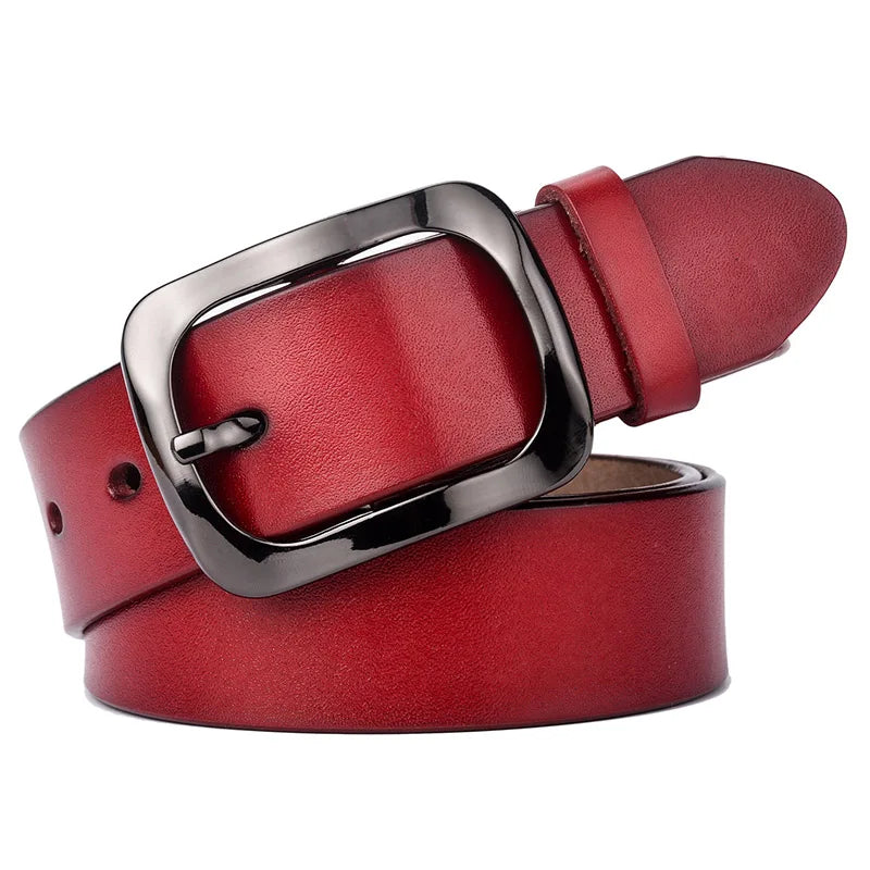Red leather belt with a silver buckle on a white background