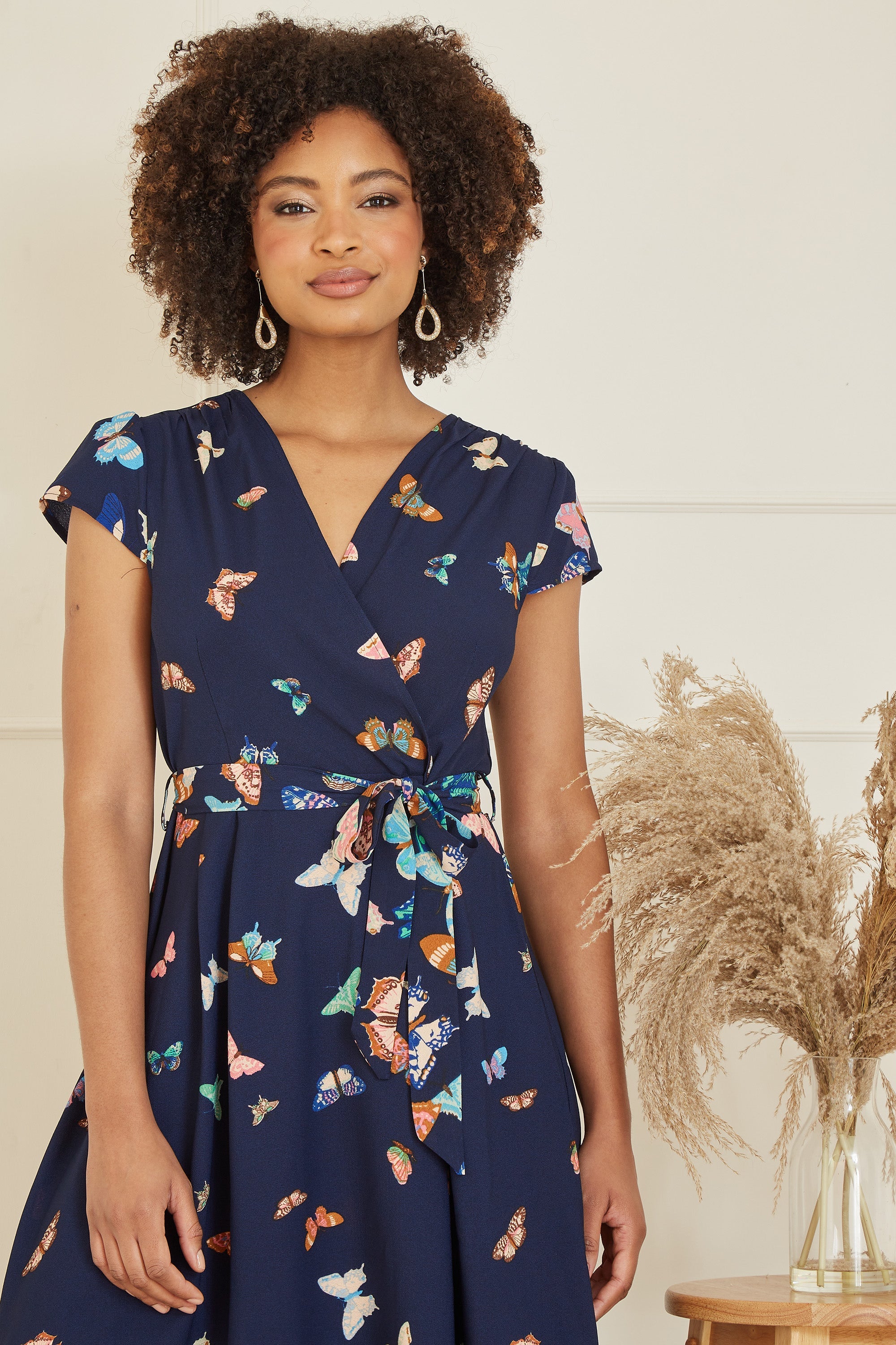 Yumi Navy Butterfly Print Dip Hem Midi Wrap Dress - QHA UK