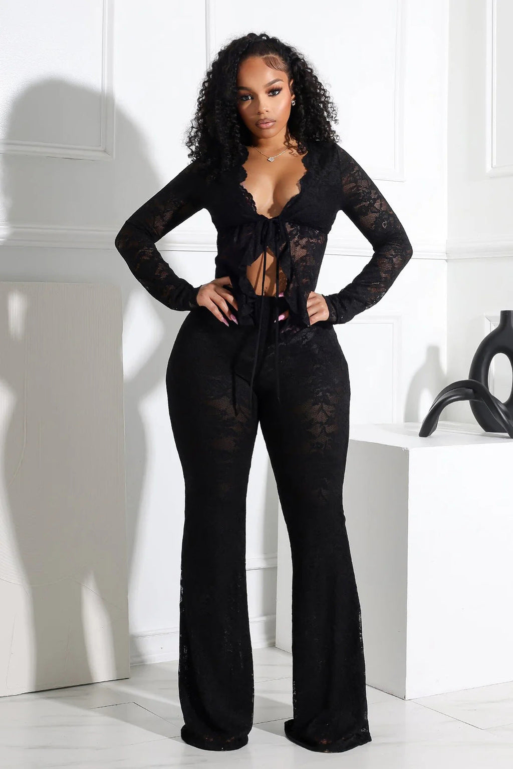 A two-piece set of women's sexy lace-up, hollowed-out cardigan, long-sleeved lace blouse and lace pants