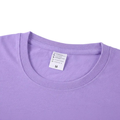 Close-up of a purple t-shirt with a label on a white background