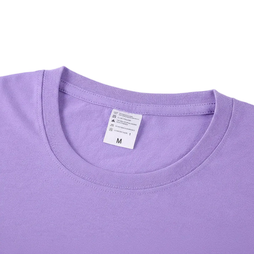 Close-up of a purple t-shirt with a label on a white background