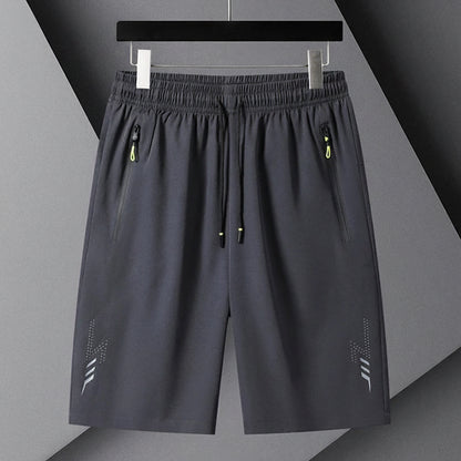 Gray shorts with black drawstring on a gray background