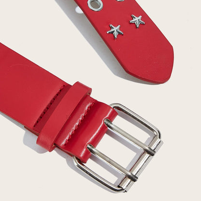 Red leather belt with silver buckle and star-shaped studs on a light background