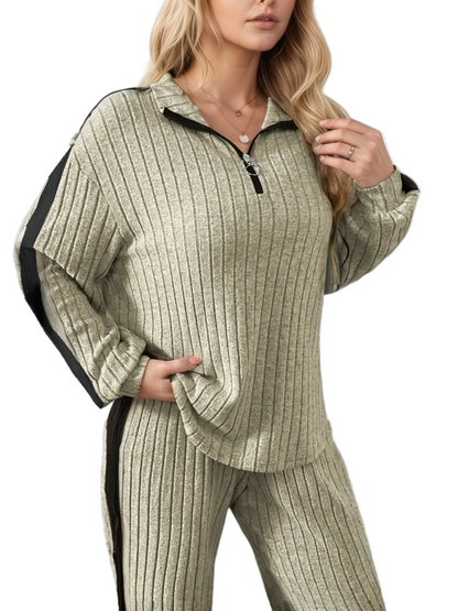 Woman wearing a ribbed knit outfit with a white background
