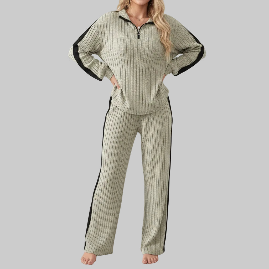 Woman wearing a ribbed knit outfit with a white background
