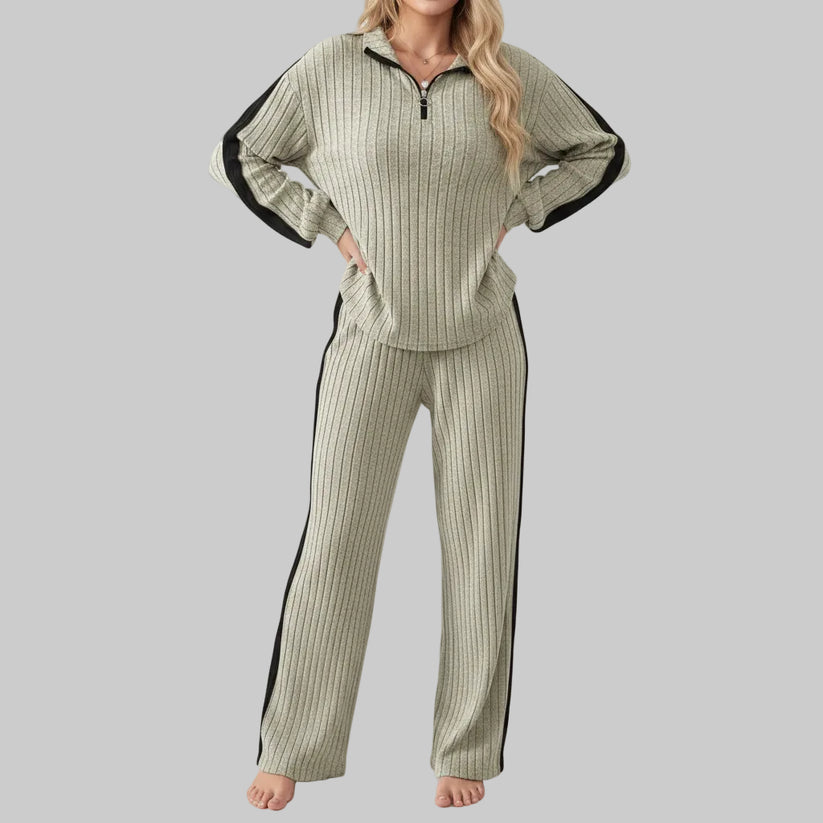 Woman wearing a ribbed knit outfit with a white background