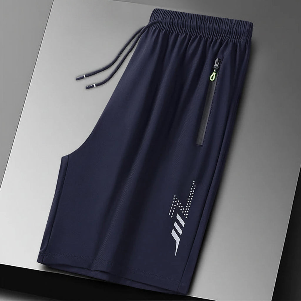Navy blue shorts with a logo on a gray background, branded 'MANTLCONX'.