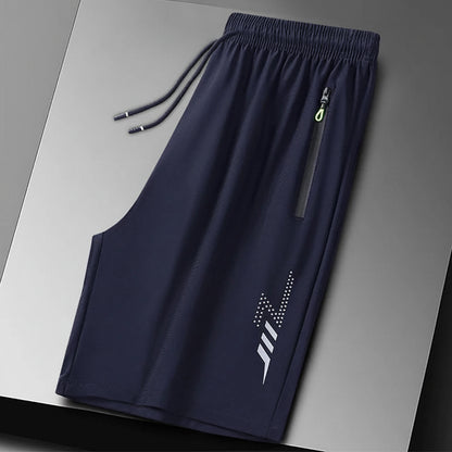 Navy blue shorts with a logo on a gray background, branded 'MANTLCONX'.