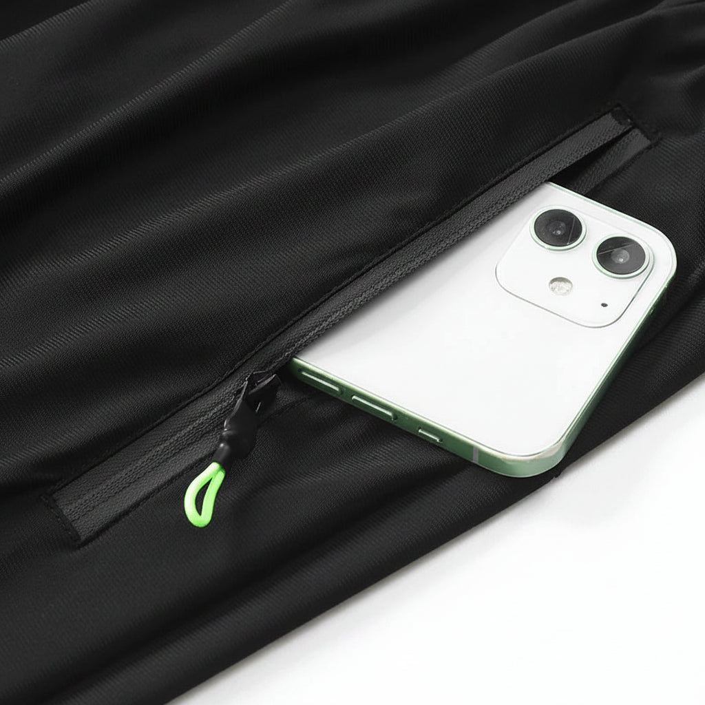 Phone in a black jacket pocket with MANTLCONX branding.