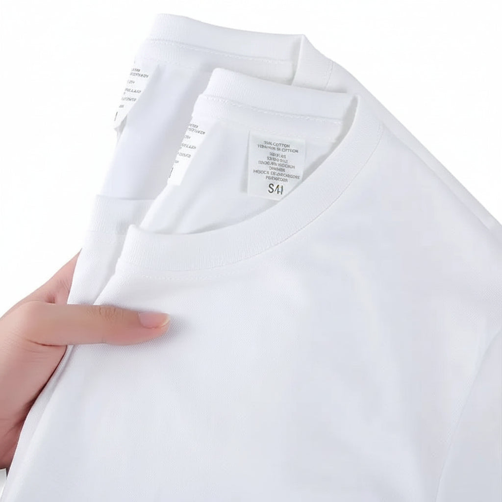 White t-shirt held by a hand with text on a white background