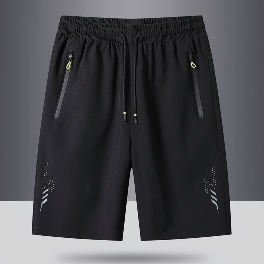 Black shorts with zippers on a gray background, featuring the brand 'MANTLCONX'.