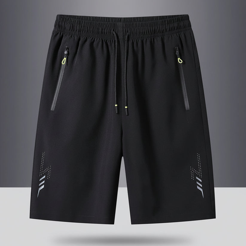 Black shorts with zippers on a gray background, featuring the brand 'MANTLCONX'.