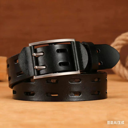 A black leather belt with a silver-tone metal buckle, rolled and displayed on a wooden surface with a warm brown background.
