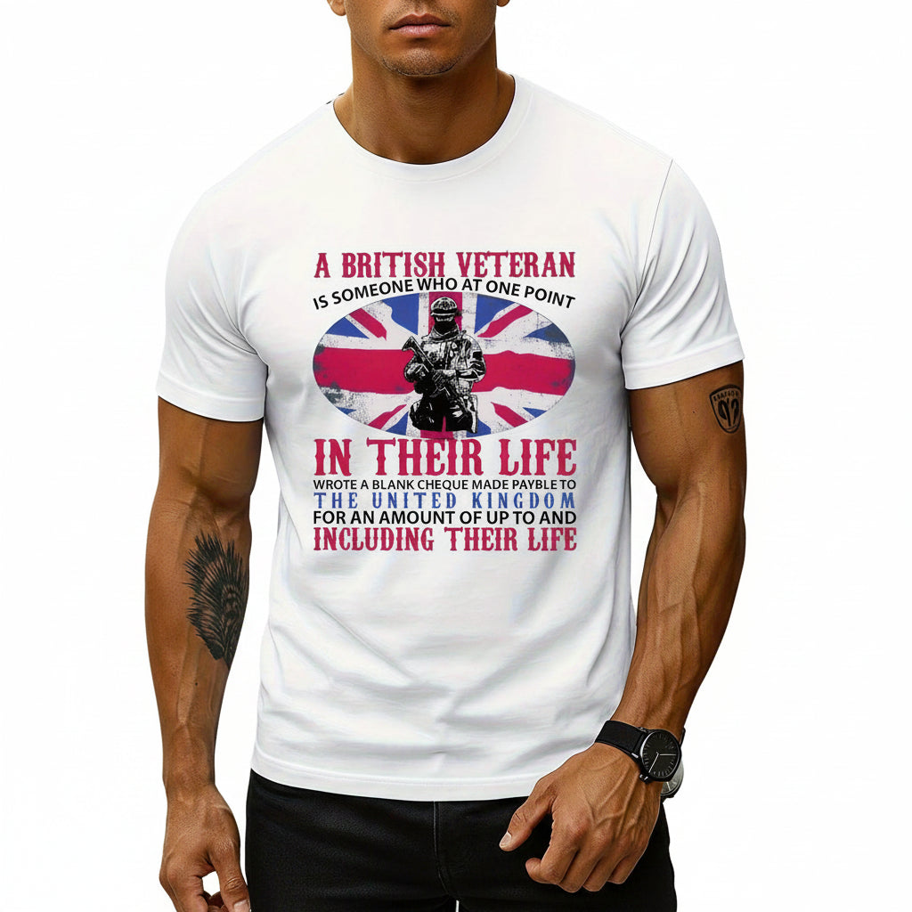 A man wearing a white short-sleeve graphic T-shirt with red and blue text and a Union Jack design featuring a soldier. The shirt has a '100% Cotton' badge in the top left corner.