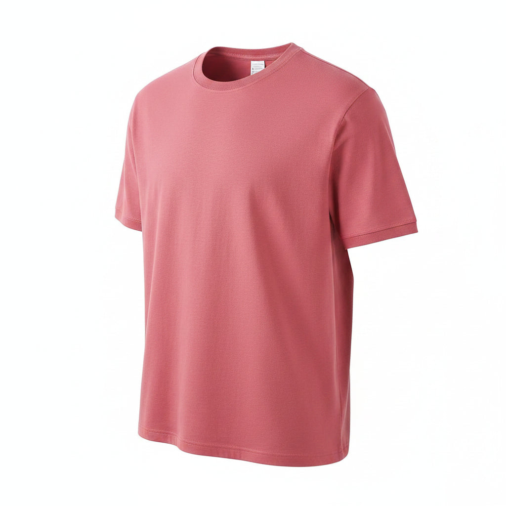 Red t-shirt held by a hand with a visible label on a white background