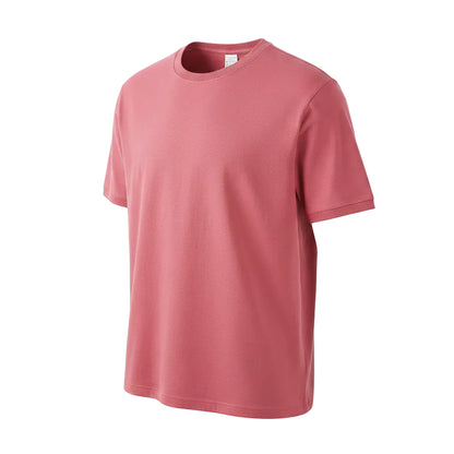 Red t-shirt held by a hand with a visible label on a white background