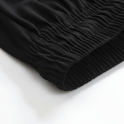 Close-up of black ribbed fabric on a white background