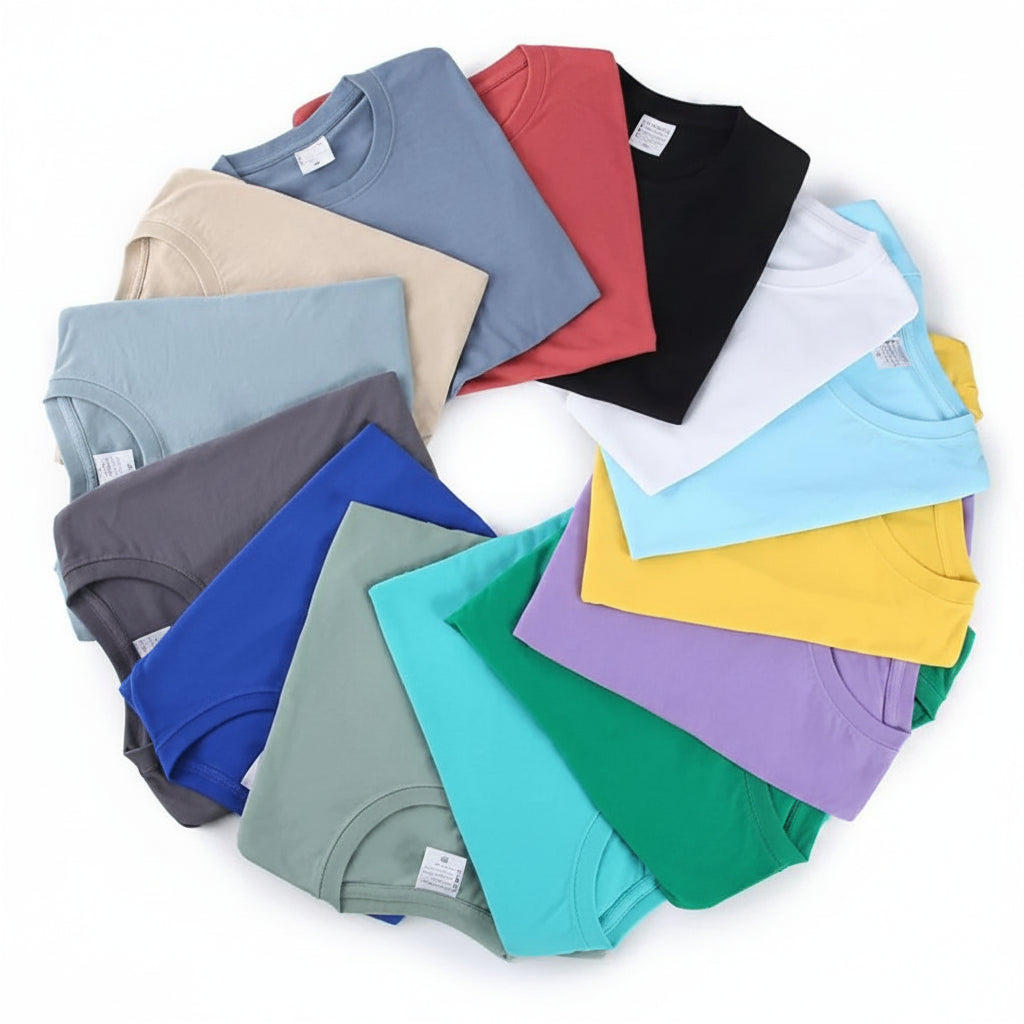Stack of folded colorful t-shirts on a white background