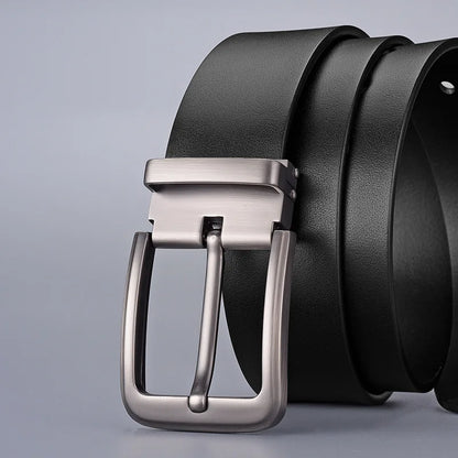 Black leather belt with a silver buckle on a light gray background