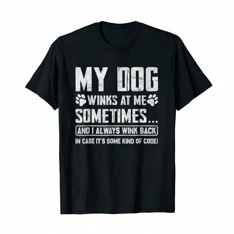 A black short-sleeve crewneck t-shirt with a humorous white graphic print on the front that reads 'MY DOG WINKS AT ME SOMETIMES.