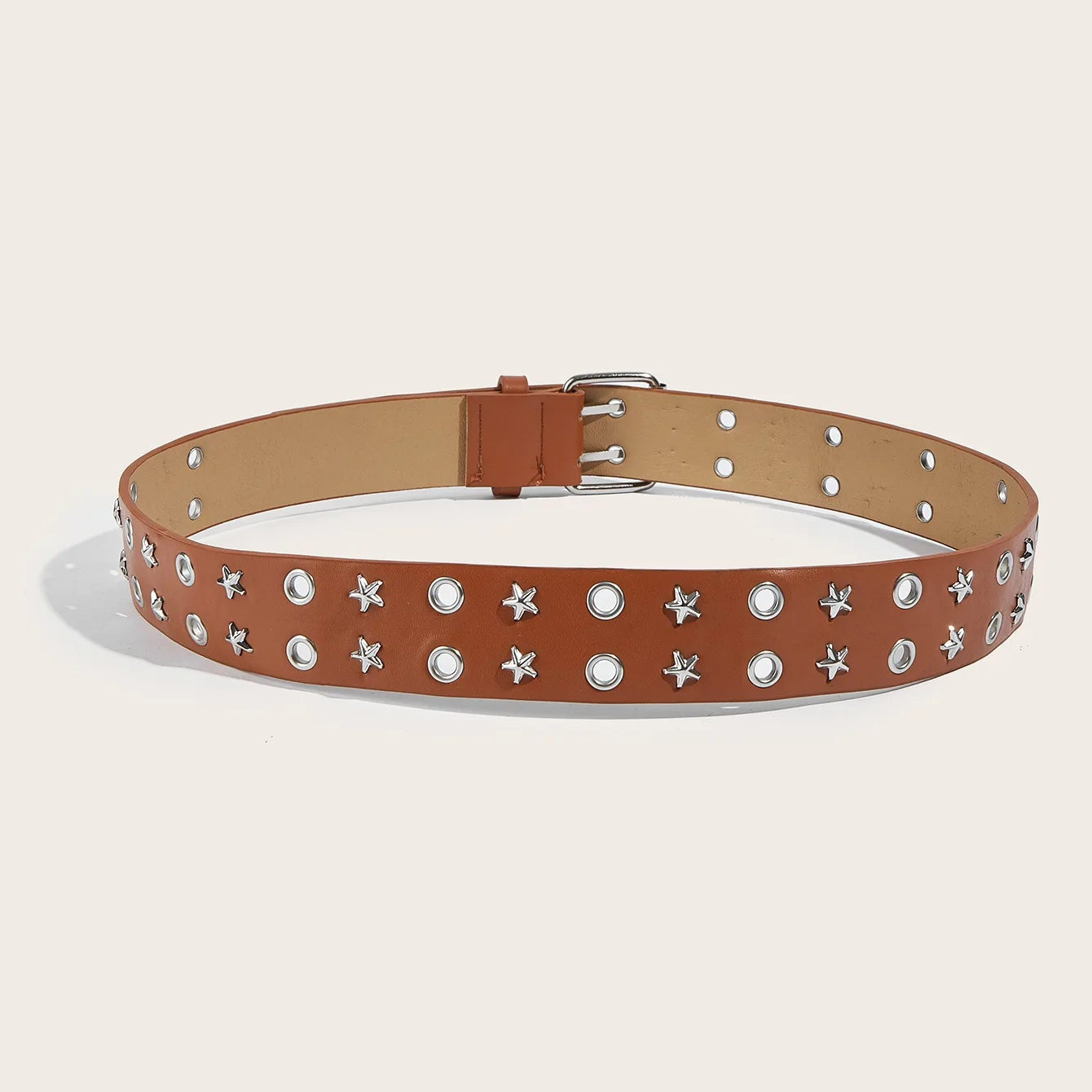 Brown belt with star and pearl embellishments on a beige background