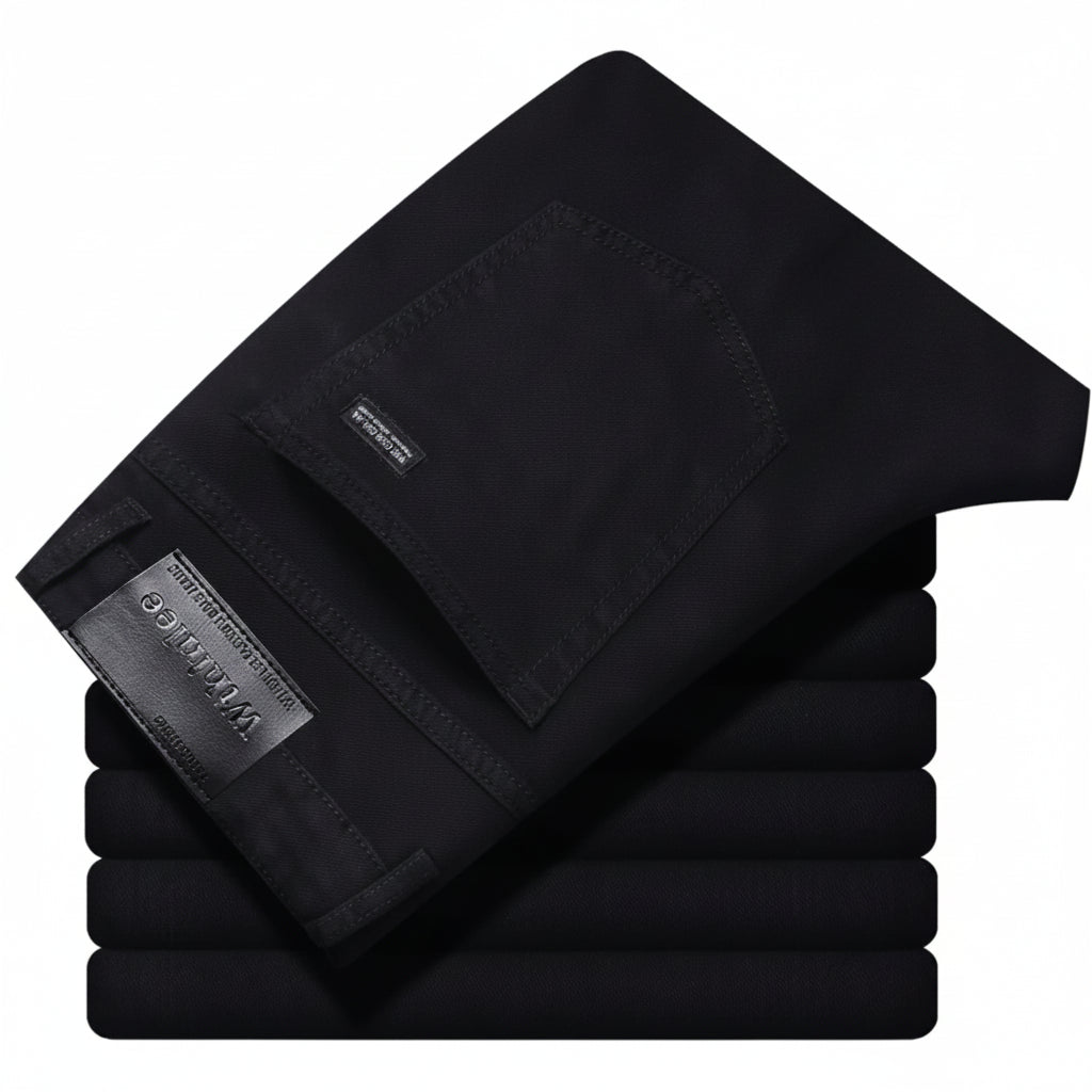 Stack of black pants with a brand label on a white background