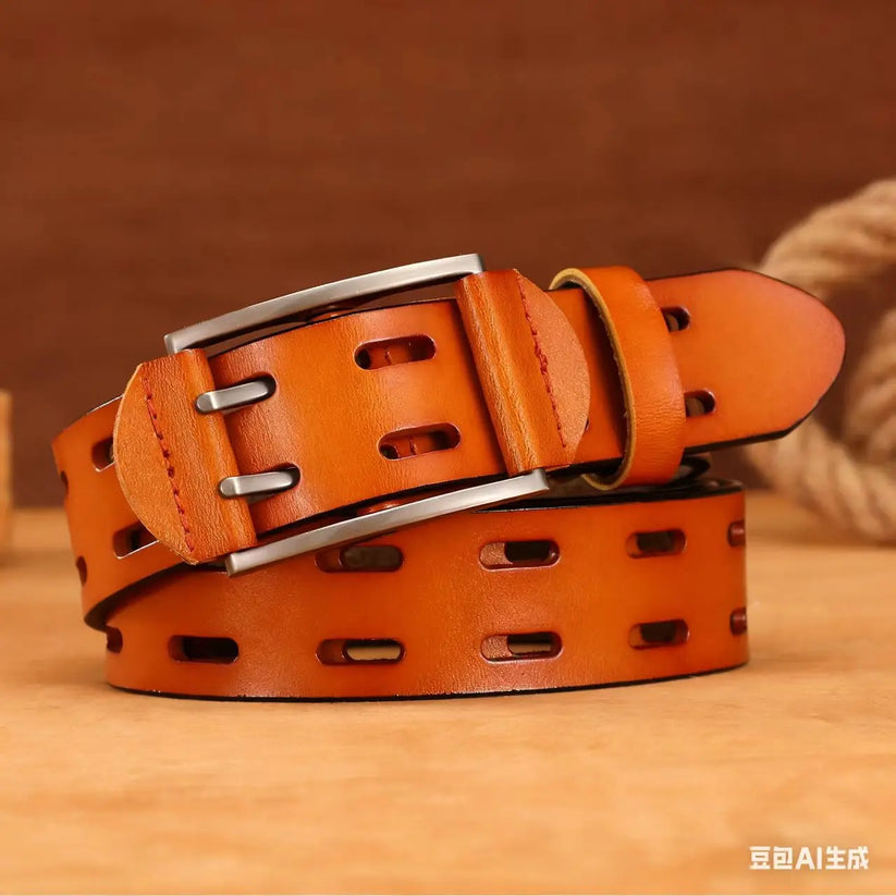 A warm brown leather belt with a silver-tone metal buckle, featuring elongated oval cutouts along the strap, coiled on a wooden surface.