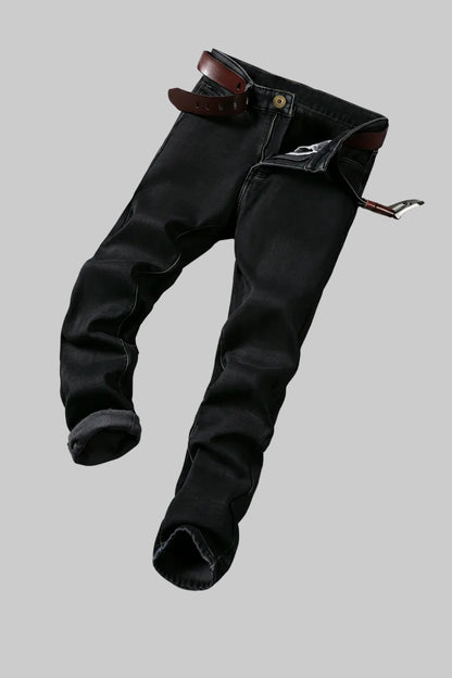 Black fleece pants with a belt on a white background, featuring a flame graphic.