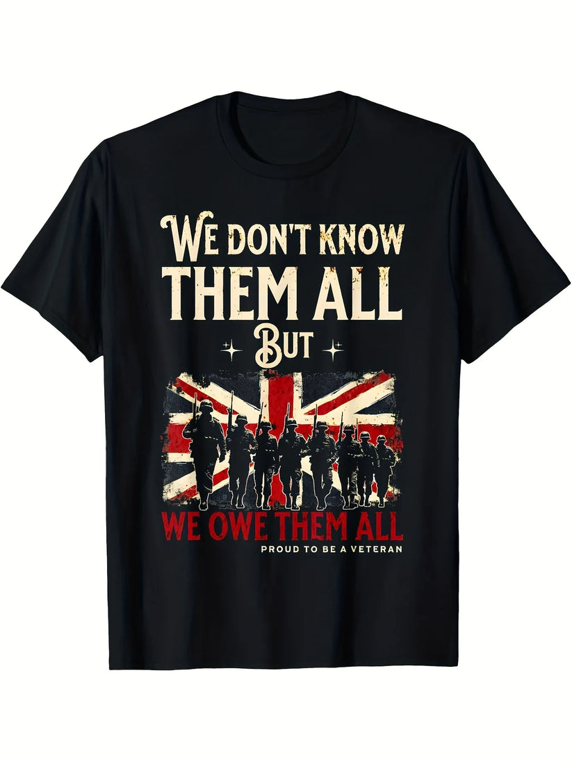 A black short-sleeve crewneck t-shirt with a graphic print on the front. The design features the text 'We don't know them all But we owe them all' in cream and red lettering, a distressed Union Jack flag, and black silhouettes of soldiers.