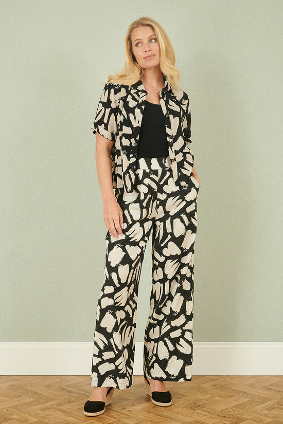 Yumi Black Cotton Splash Print Relaxed Fit Trousers - QHA UK