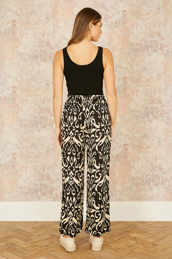 Yumi Black Ikat Print Relaxed Fit Trousers - QHA UK