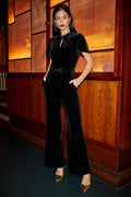 Yumi Black Velvet Jumpsuit With Twist Neckline And Buckle Belt - QHA UK