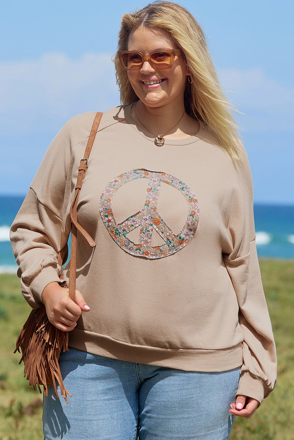 A pale khaki plus-size sweatshirt featuring a floral peace sign graphic and a Washed Terry Finish