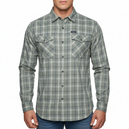 A long-sleeve button-up shirt with a gray, white, and blue plaid pattern, featuring two buttoned chest pockets and a small brand patch on the left chest.